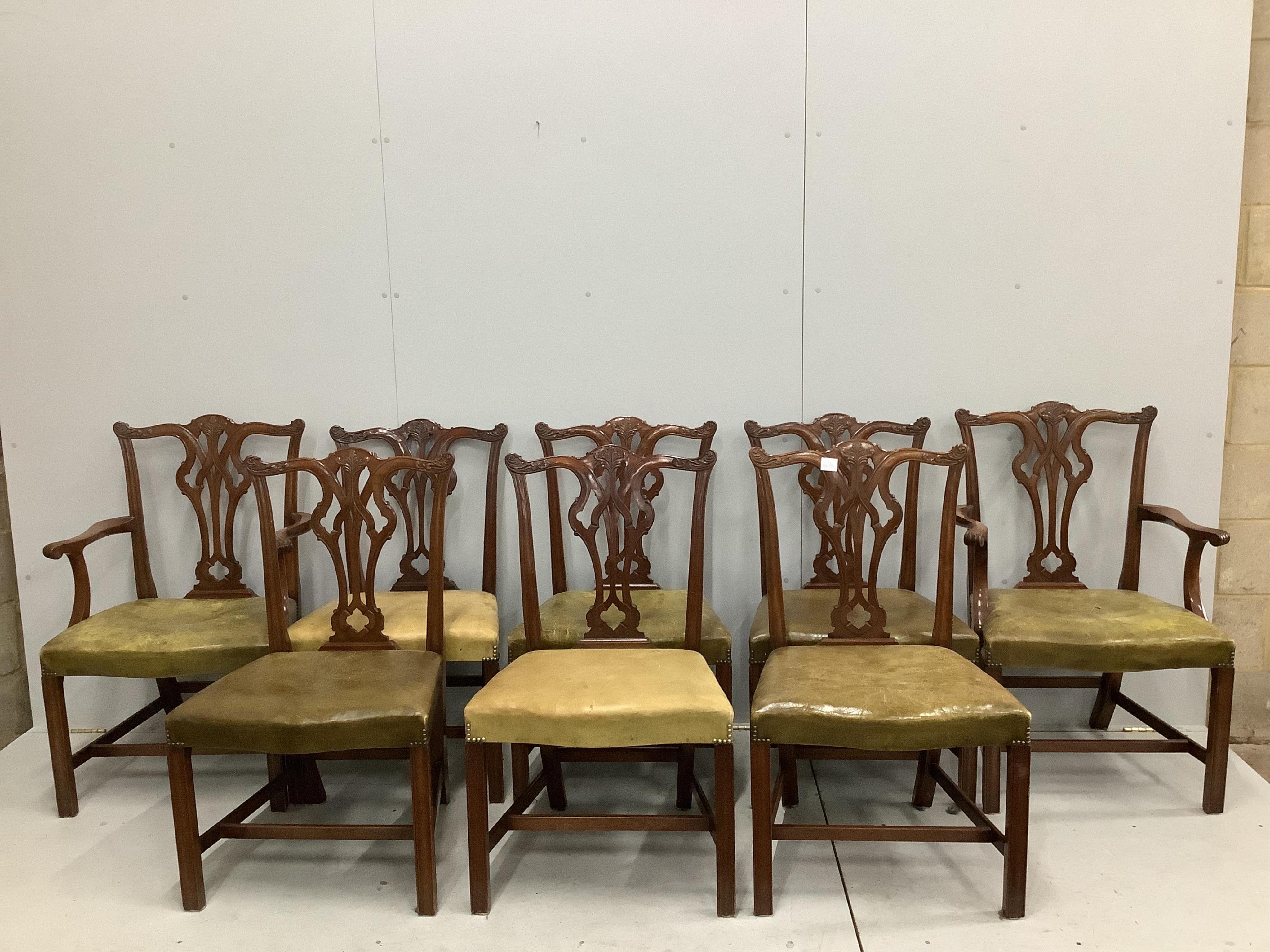 A set of eight reproduction Chippendale style mahogany dining chairs with green leather seats, two with arms. Condition - fair to good